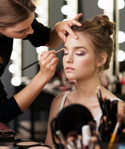 make-up-artist-applying-professional-make-up-beautiful-young-woman_1042628-532301