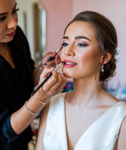 makeup-artist-pnts-lips-bride-makeup-artist-makes-young-beautiful-bride-bridal-makeup_1358627-3496