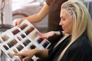 woman-getting-her-hair-dyed-beauty-salon_23-2149167372